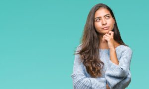 Woman looking up and right like she's questioning something
