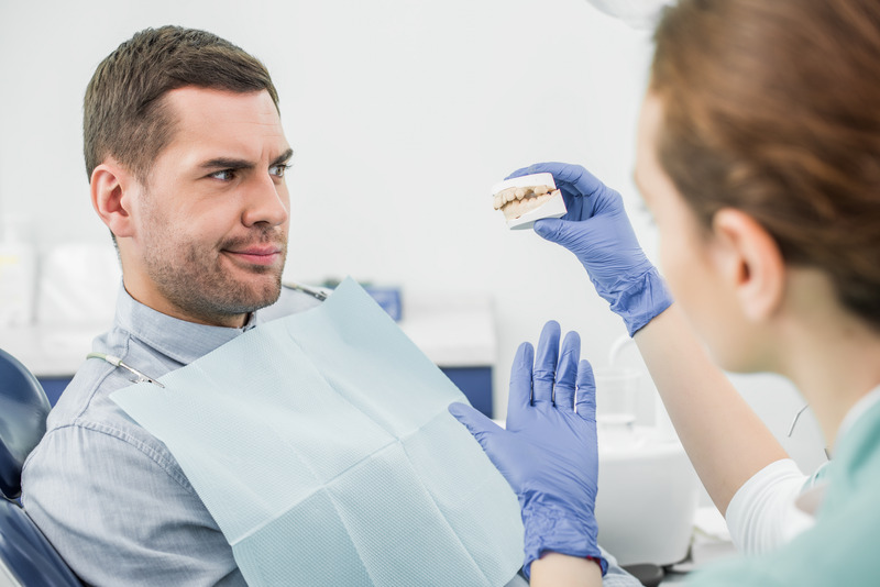 Patient looking uncomfortable before their root canals